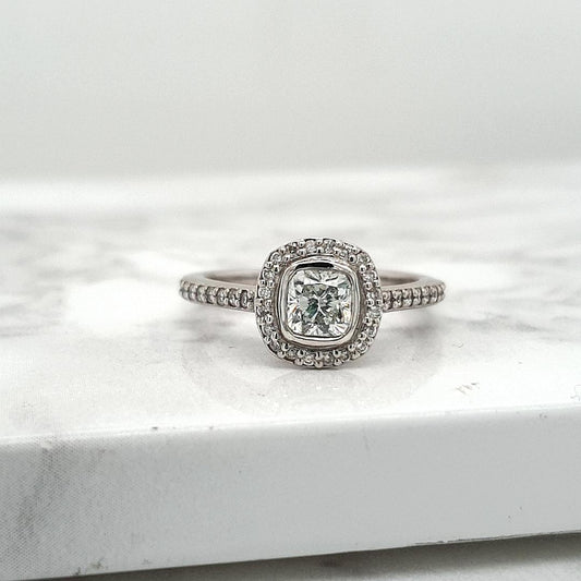 18ct White Gold 0.52ct Cushion Cut Bezel Set & 0.24ct Accent Round Brilliant Claw Set Halo with Shoulder Diamond Ring