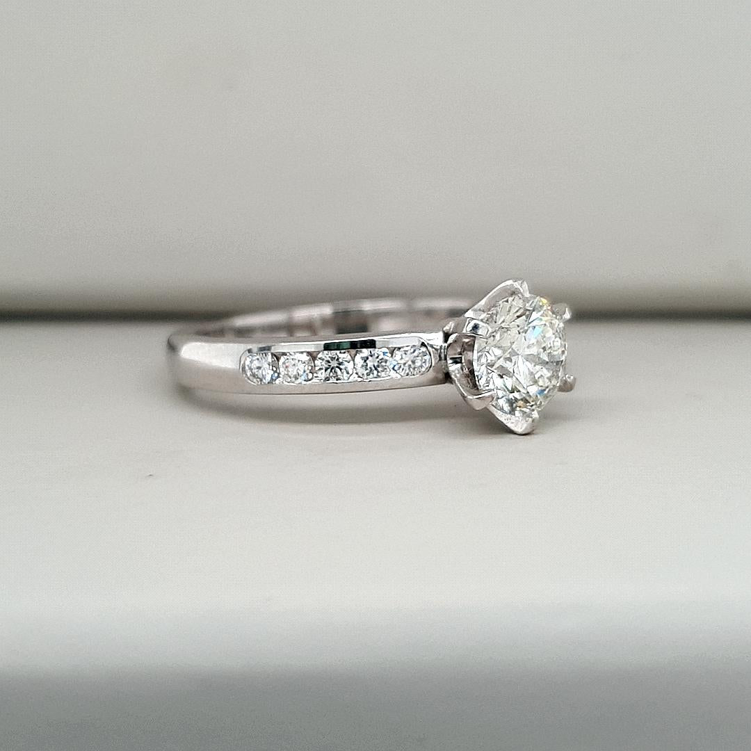 18ct White Gold 1.00ct Round Brilliant Centre Diamond Claw Set with Accent Diamonds Channel Set Ring