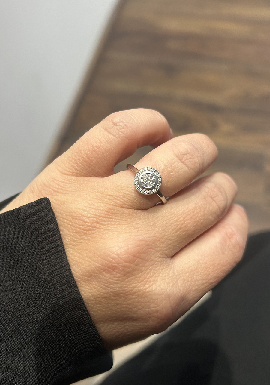 18ct White Gold Round Brilliant Bezel Set Diamond with Accent Round Brilliant Diamond Halo Ring