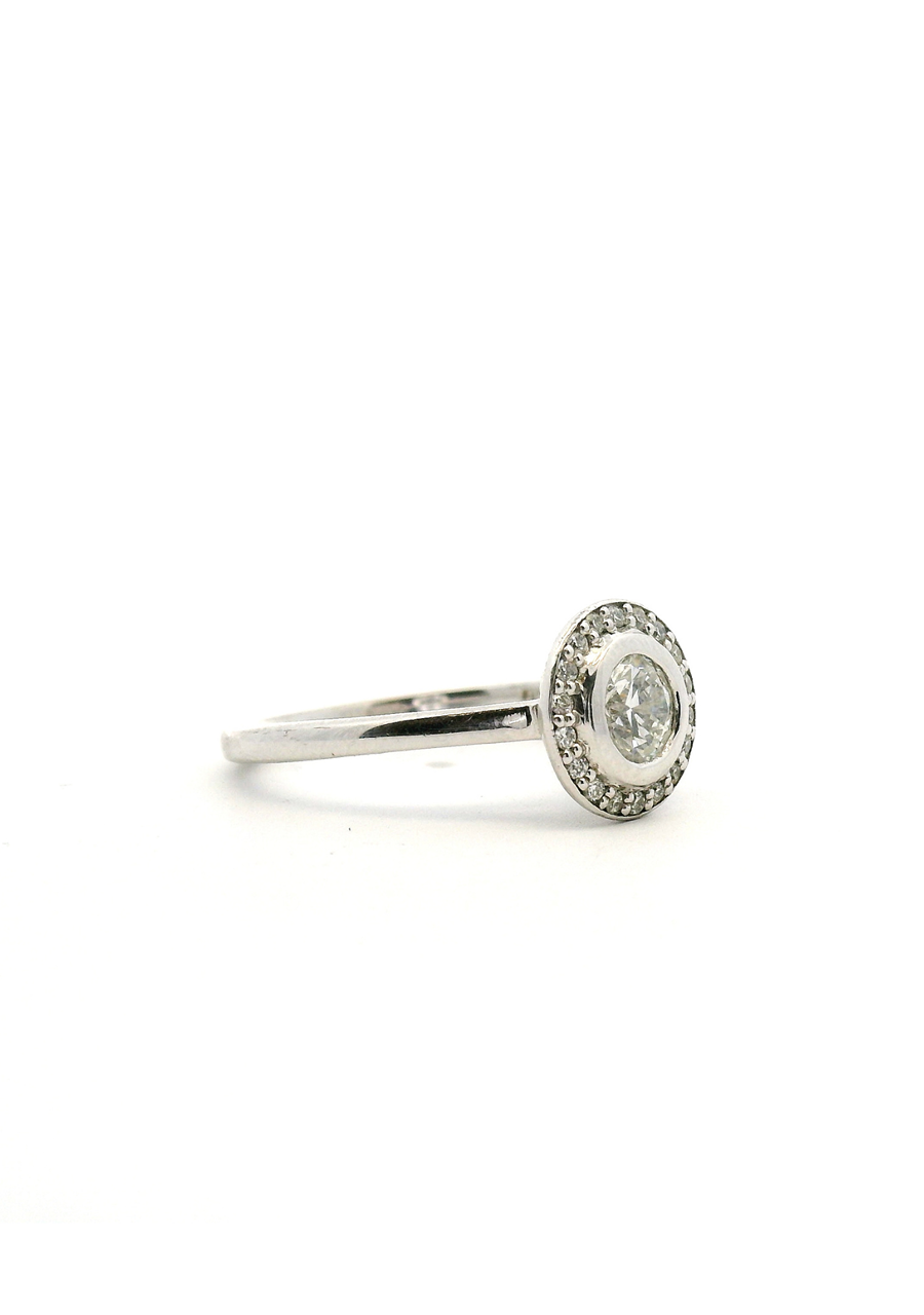 18ct White Gold Round Brilliant Bezel Set Diamond with Accent Round Brilliant Diamond Halo Ring