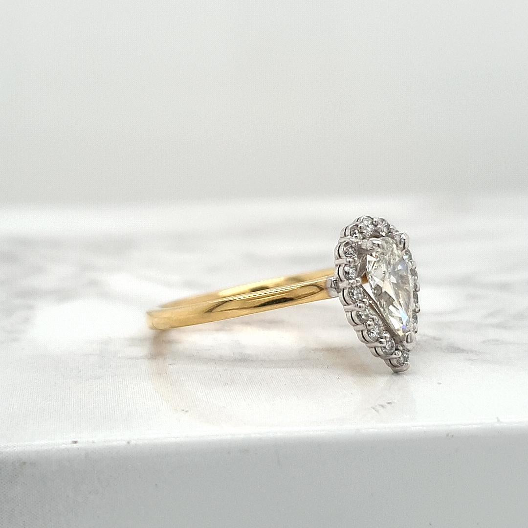 18ct Yellow & White Gold 0.70ct Pear Cut with 0.16ct Accent Round Brilliant Diamond Halo Ring