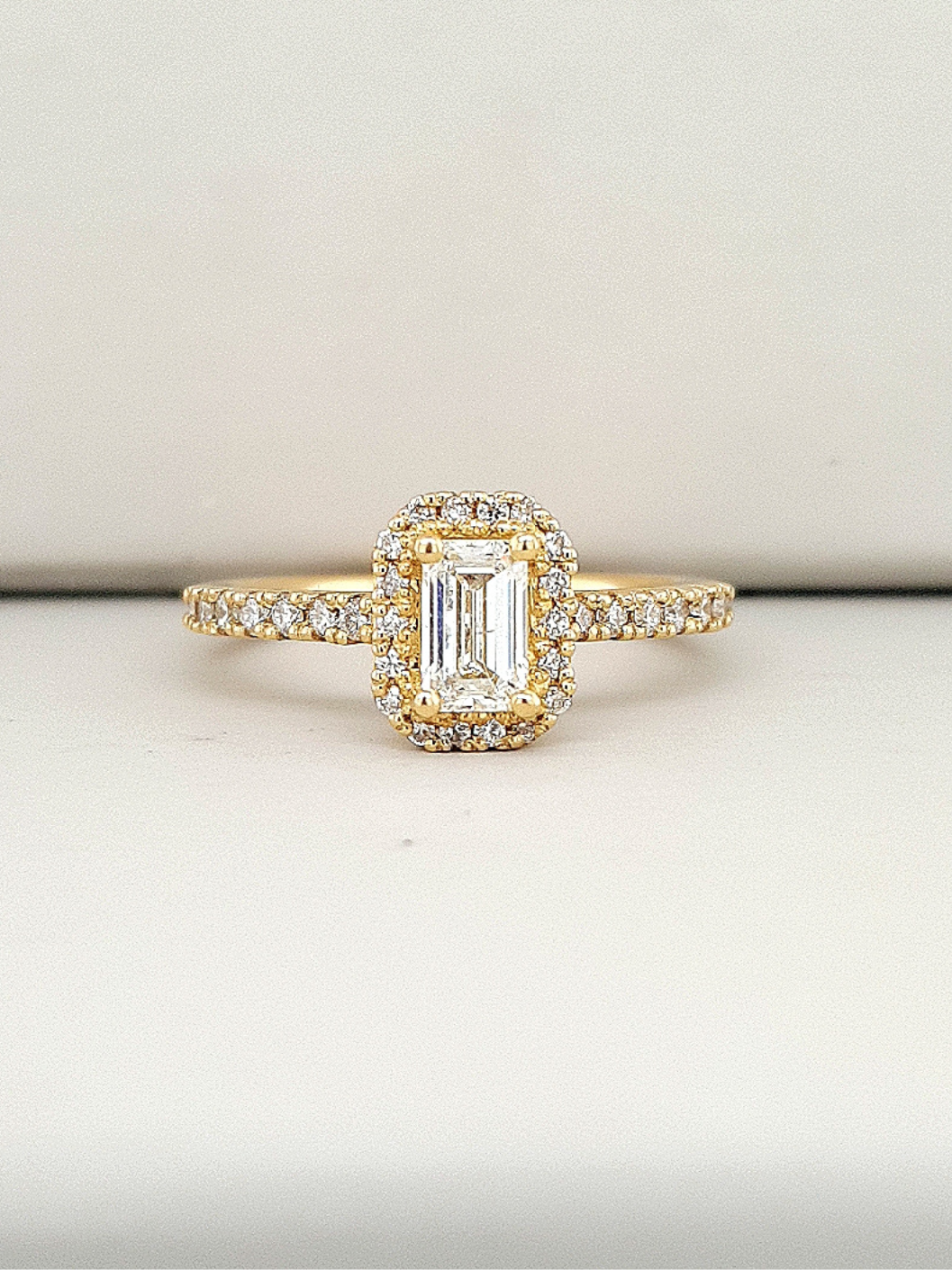 18ct Yellow Gold 0.50ct Emerald Cut Diamond Halo Ring