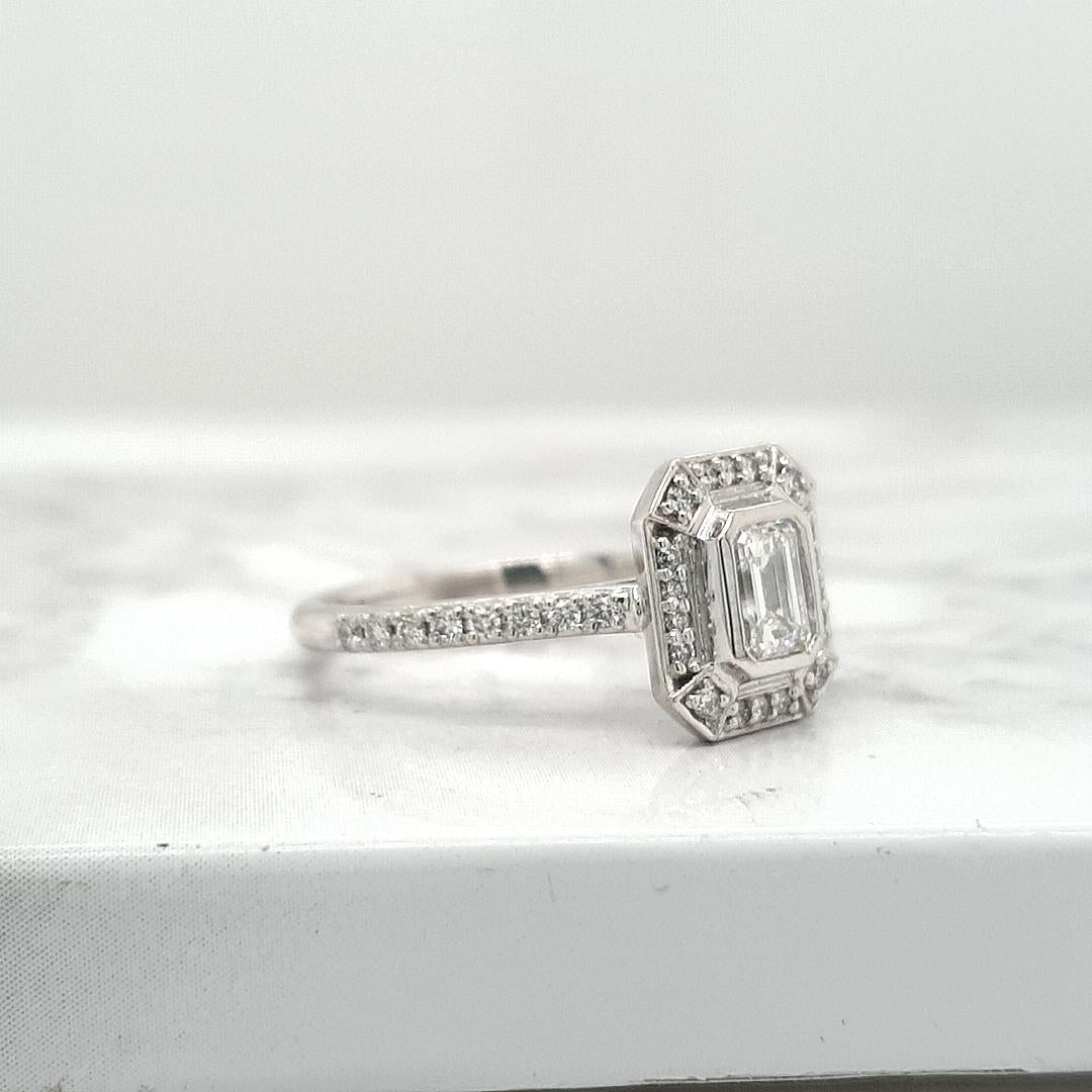 18ct White Gold Emerald Cut Halo Engagement Ring