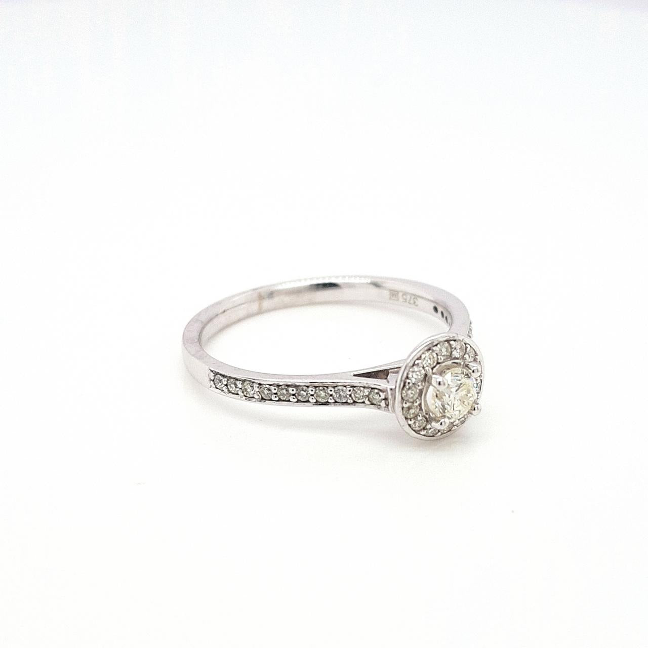 9ct White Gold 0.18ct Round Brilliant Diamond 0.14ct Halo with Shoulder Diamond Cluster Ring